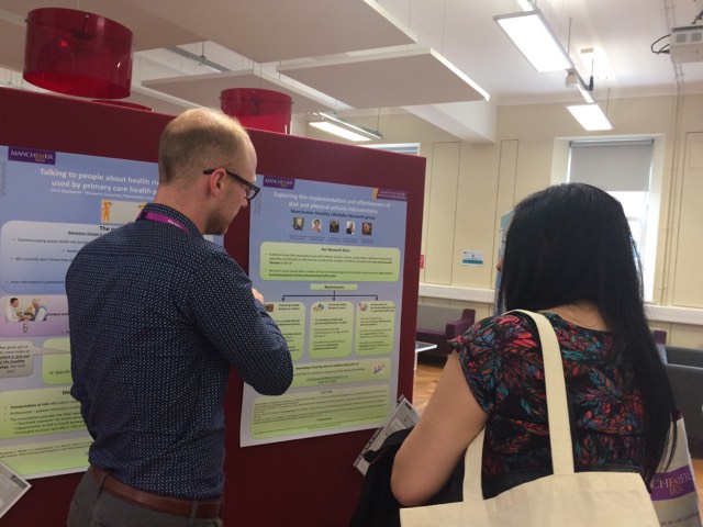 Chris Keyworth talking to a visitor about his research