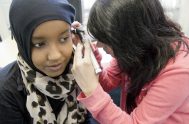 Students working with audiology equipment